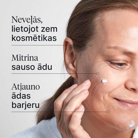 Dienas krēma tekstūras tuvplāns uz sievietes sejas